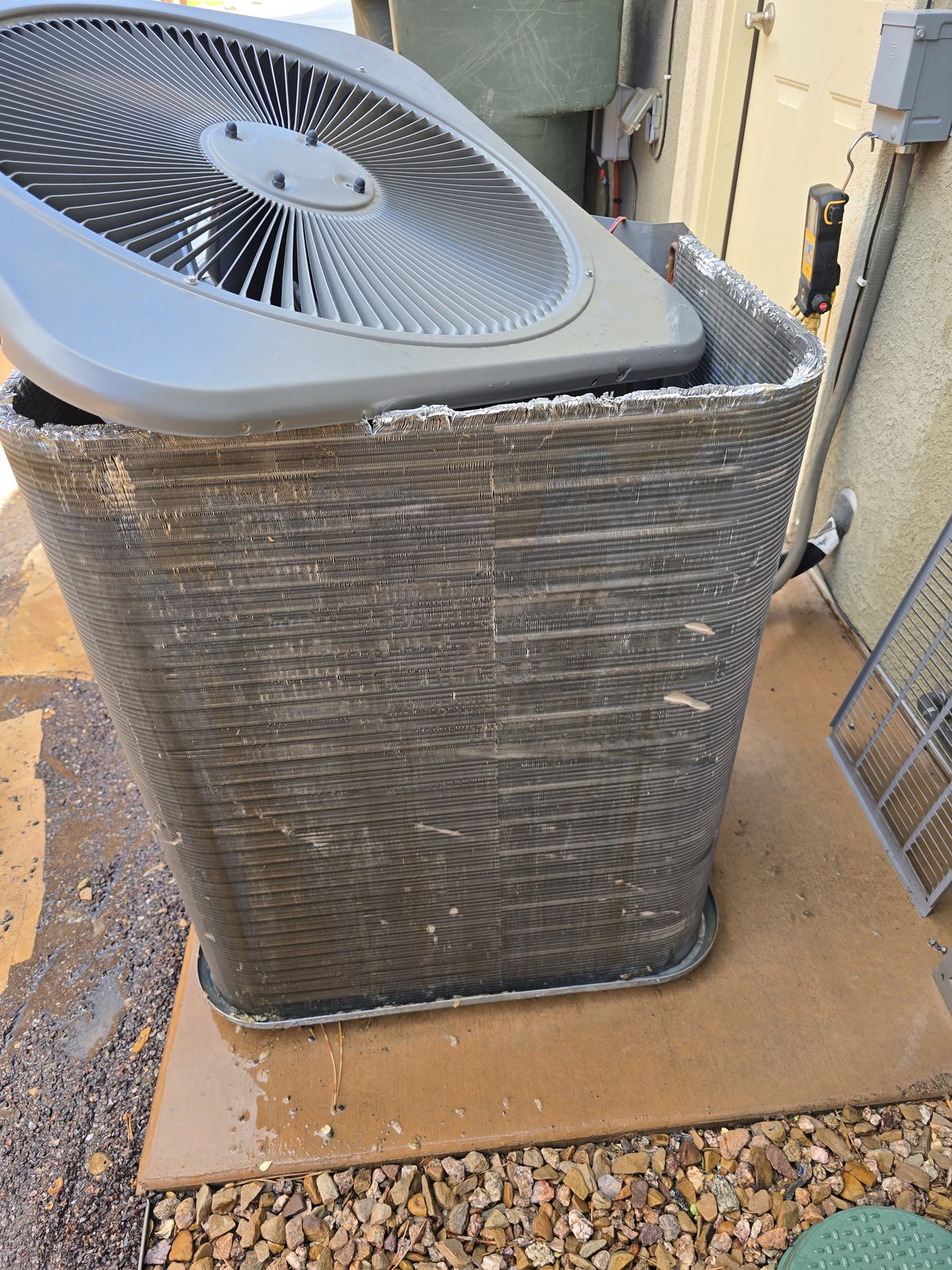 Clean AC condenser coil after service