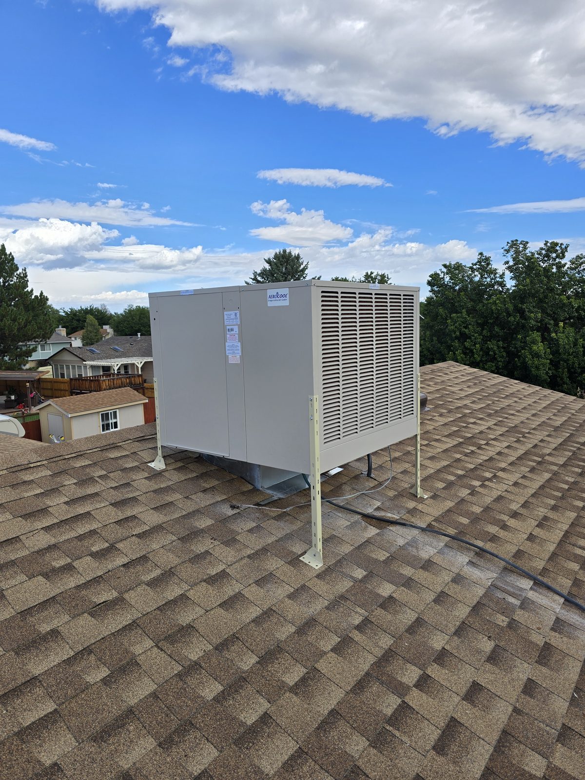 New evaporative cooler installed on rooftop